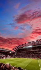 Red clouds in sunset over the ground of a stadium