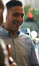A group of people drinking at a bar