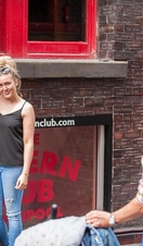 A woman posing outside the Cavern Club in Liverpool, a famous venue in the history of the Beatles