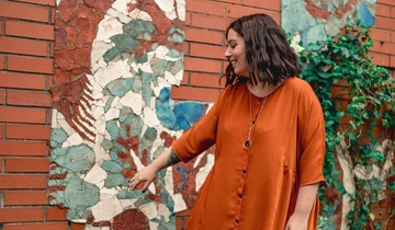 Standing infront of a mural