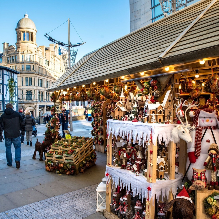 Christmas market stalls lining Cathedral Street in Manchester