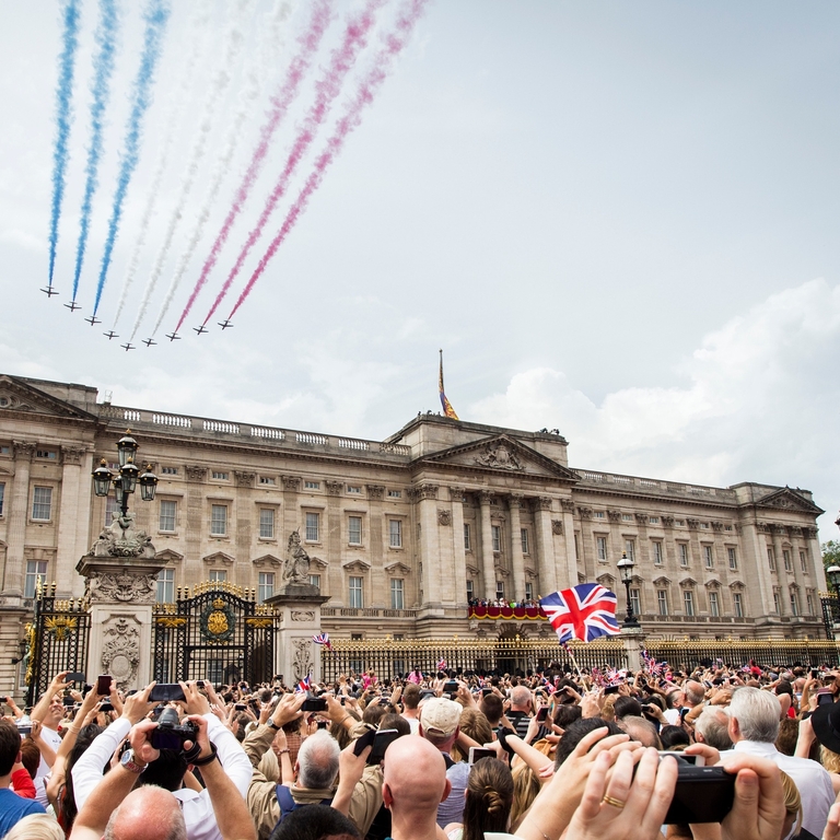 Aerial display flying over crowds above palace
