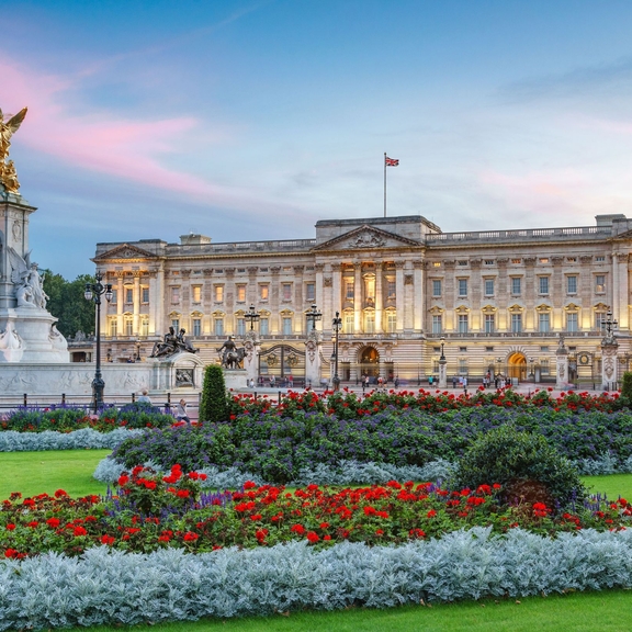 View of Buckingham Palace early morning with gardens in the foreground