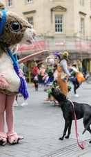 A dog and a performer in a mouse costume as part of Bath Fringe Festival