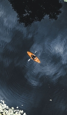 An overhead view of a person kayaking down a river in Leicestershire