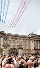 Aerial display flying over crowds above palace