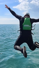 A man diving into the sea on the Jurassic Coast
