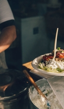 Chef serving up food at Abergavenny Food Festival, Wales