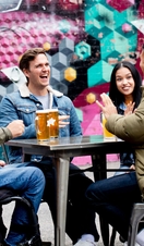 friends enjoying a beer in outdoor beer garden