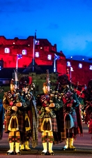 Marching band and light show projecting onto the castle