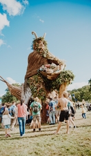 Group of people standing around large sculpture