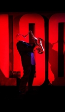 A jazz performer on stage at the 100 Club, an intimate and historic venue in the heart of London's Soho district