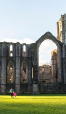 Visitors walking in the garden at Fountains Abbey and Studley Royal Water Garden, North Yorkshire