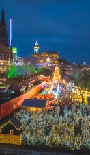 A night view over Princes Street Gardens with the Christmas Market lights