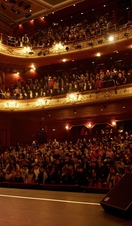 A performer on stage at Bradford Literature Festival