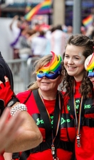 Group of people celebrating Pride on the streets of Cardiff, Wales