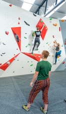People climbing an indoor bouldering wall in Lancashire