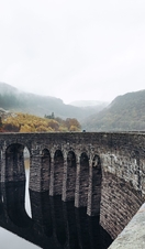 Two people walking down Elan Valley in Wales