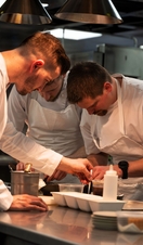 Chefs working in the restaurant kitchen at Whatley Manor, Malmesbury