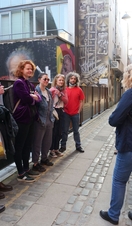 Group of people on street taking part in Belfast Music Tours