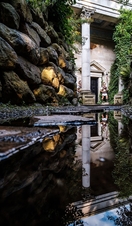 Statues of Roman Soldiers flanking an entrance in the Forbidden Corner labyrinth attraction in Yorkshire