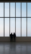 Two people looking out of a large window, Turner Contemporary
