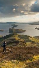 Walkers taking in the view of Loch Lomond from Conic Hill part of the West Highland Way