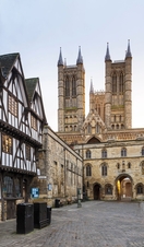 Lincoln Cathedral with Tudor timber framed buildings in foreground