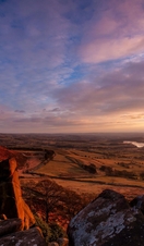 Hen Cloud and Tittesworth Reservoir from the Roaches at sunset. Peak District sandstone and the Staffordshire moorlands.