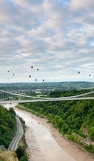 Hot air baloons floating above the Clifton Suspension Bridge in Bristol