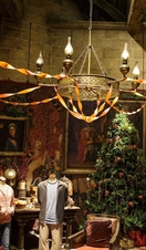 Christmas tree in Gryffindor common room with casual student clothes on dummies