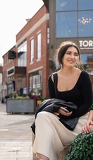 Two women sat on a bench in Lincoln's Cornhill Quarter