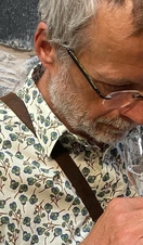 A man tasting whisky at the Ballindalloch Distillery in northern Scotland