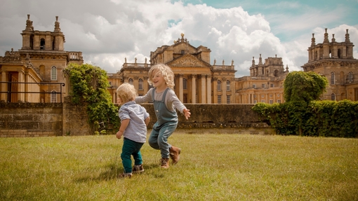 Two boys play in the grounds of Blenheim Palace