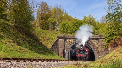 Steam train emerging from Mytholmes Tunnel, Keighley and Worth Valley Railway