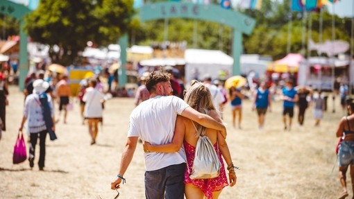 A couple walking at the Isle of Wight Festival