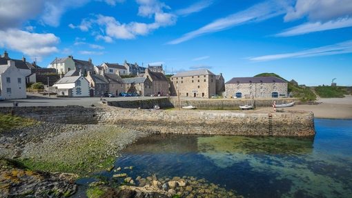A landscape shot of a harbour town on a sunny day.