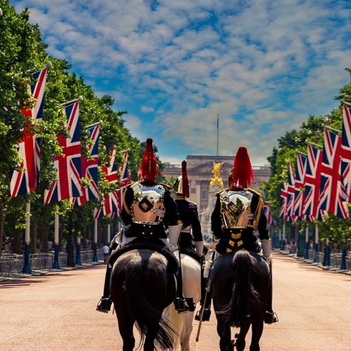 Military Guards on horses between rows of Union jack flags