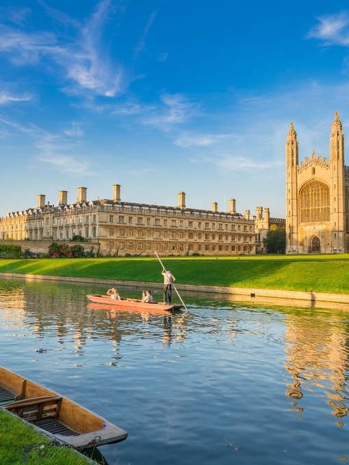 View of college in Cambridge with people punting on River