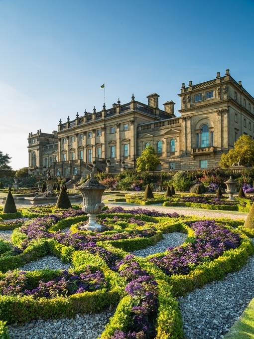The Victorian formal gardens with statues and low hedges in front of Harewood House