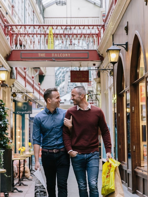 A gay couple enjoying the shopping facilities at Castle Arcade in Cardiff, Wales