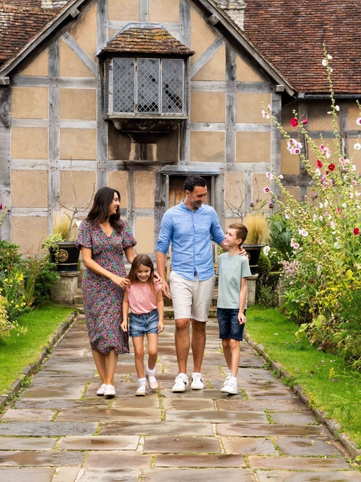 A family walking together outside heritage building