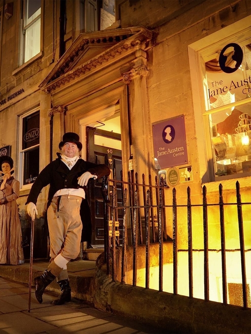 Two people in period costume outside a Victorian museum.