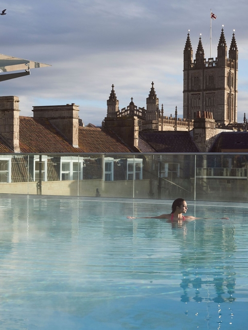 Woman swimming in a swimming pool at a spa