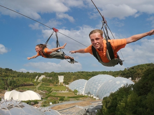 Two friends enjoying a zipline experience.