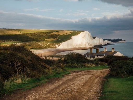 Country road with white cliffs in the background