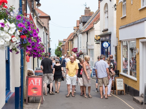 People walking through a shopping street in Wells-next-the-Sea