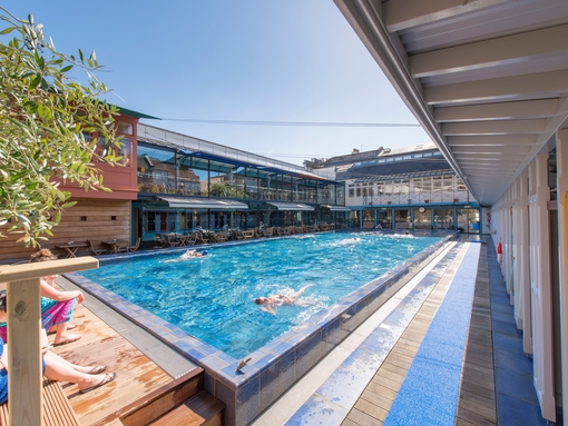 People swimming in an outdoor pool at Bristol Lido