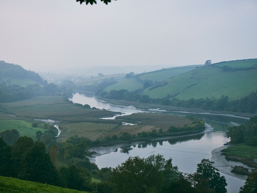 High angle landscape view of a river running through a valley.