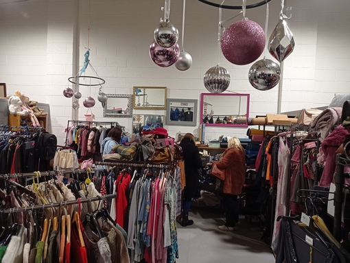Groups of people searching through clothing at the Green Heart Collective in Grainger Market, Newcastle